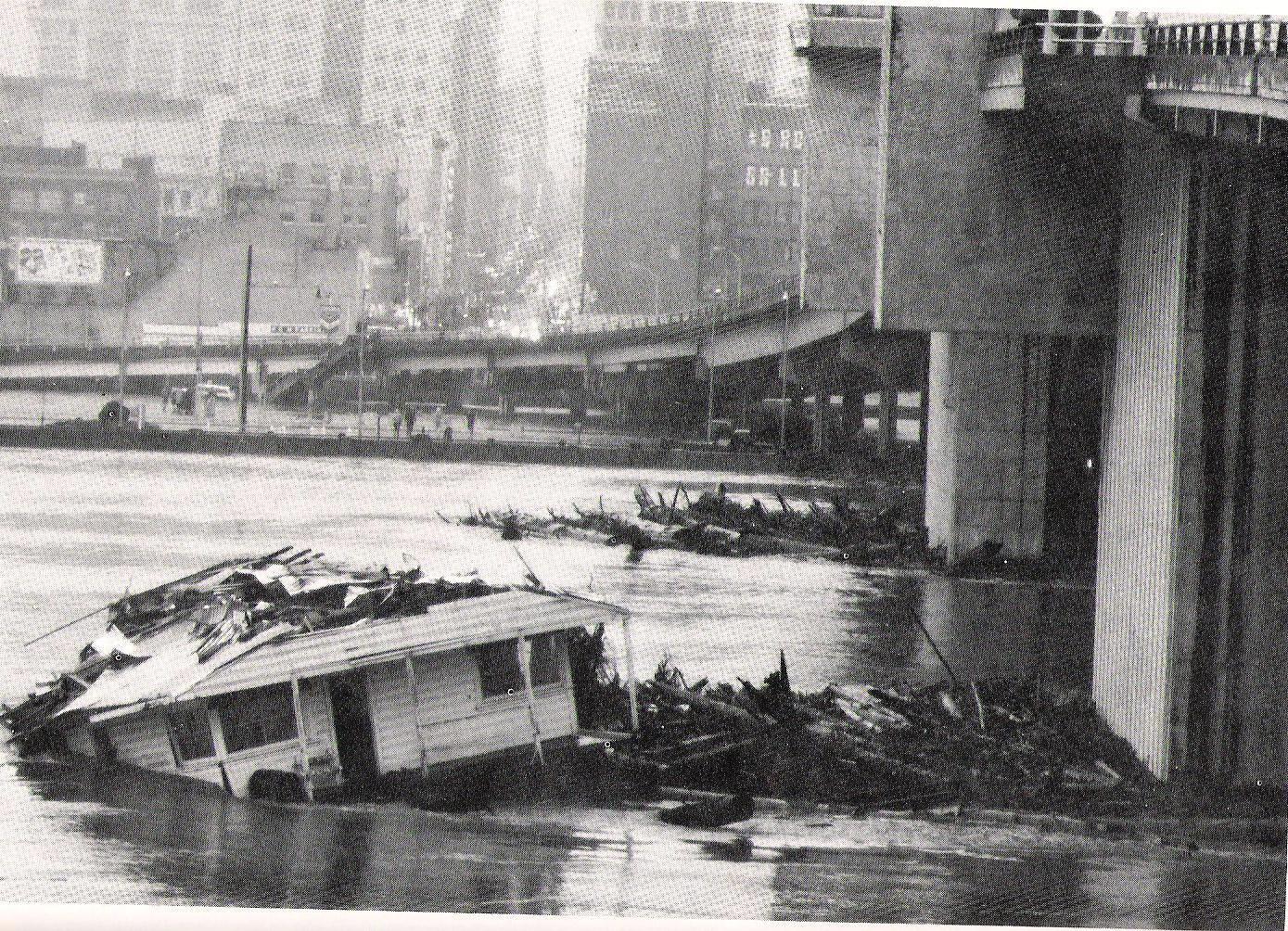 Floating home damaged during Christmas Flood of 1964